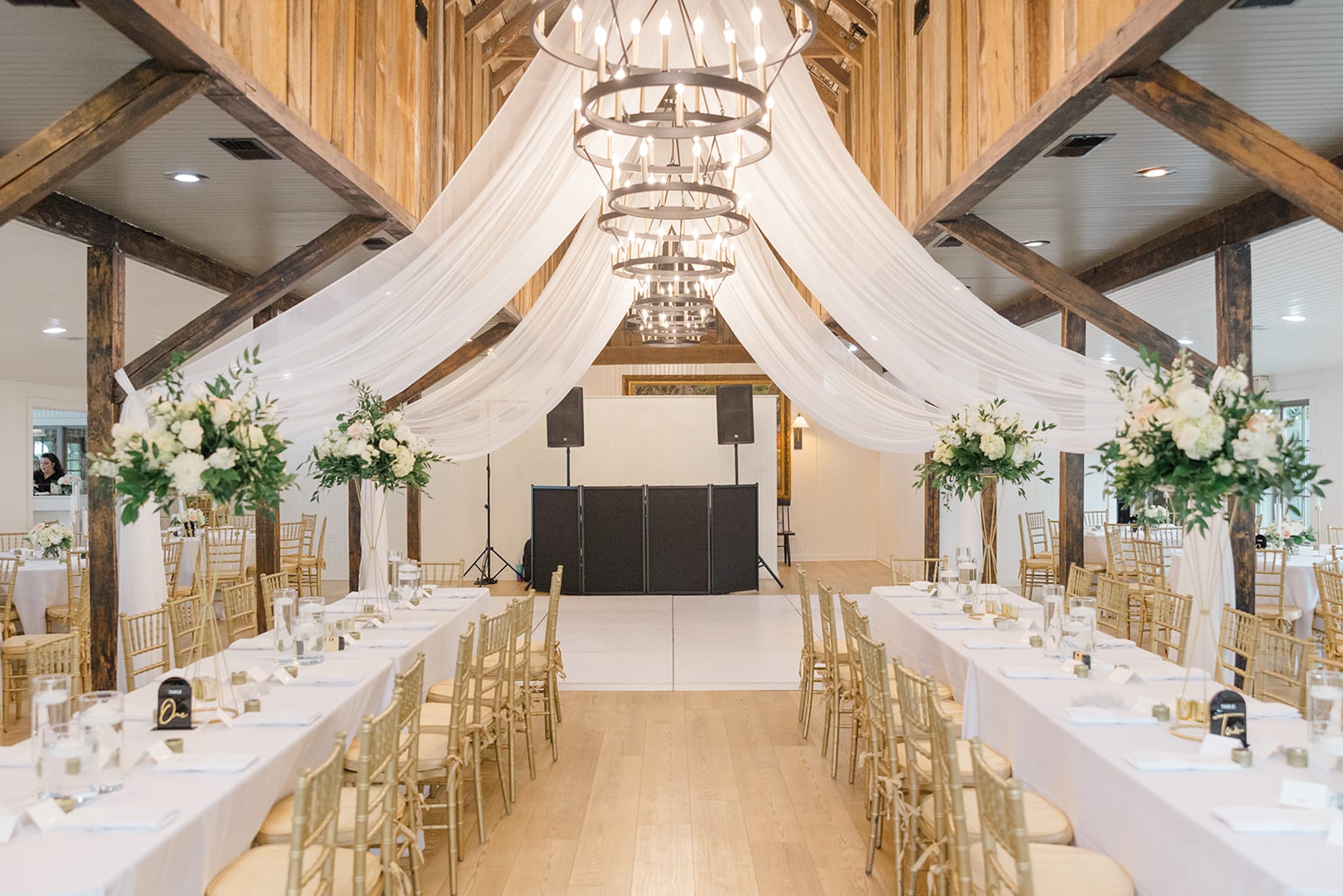 Long reception tables set for Magnolia Plantation wedding dinner