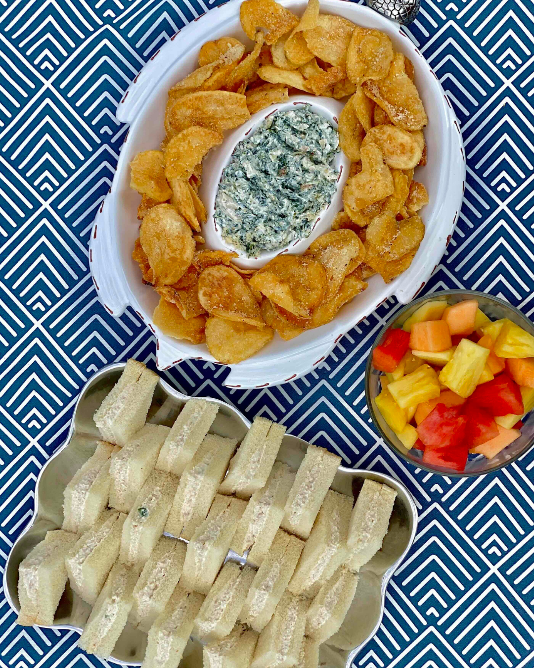 Tea sandwiches, spinach dip, housemade chips and fresh cut fruit