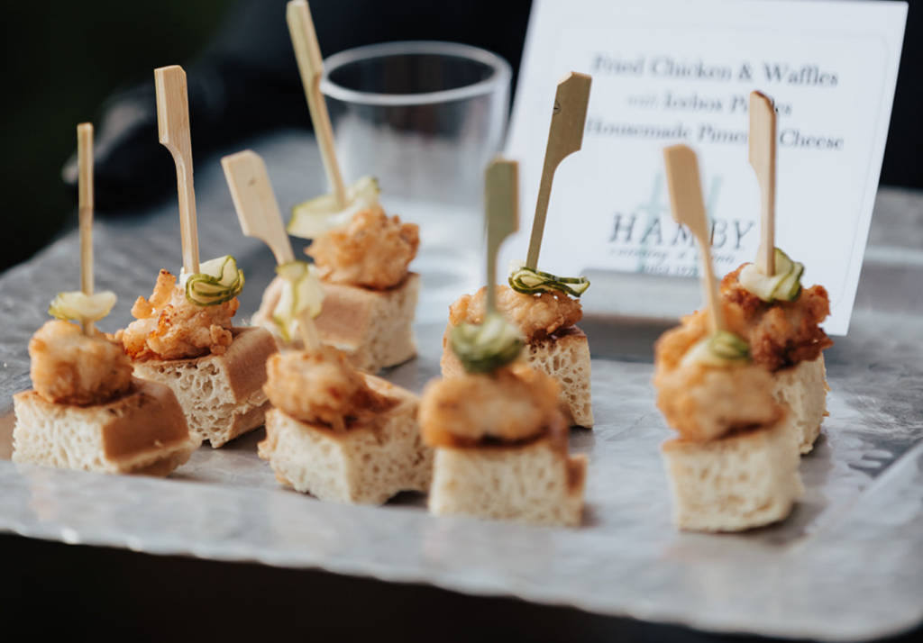 Hamby Catering's signature chicken and waffle bite appetizer served at a wedding cocktail hour.