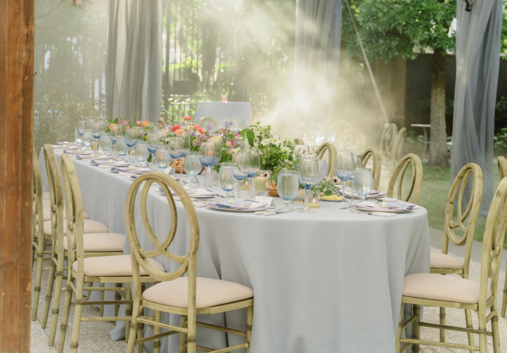Beautifully styled reception table with florals at a Charleston wedding venue.