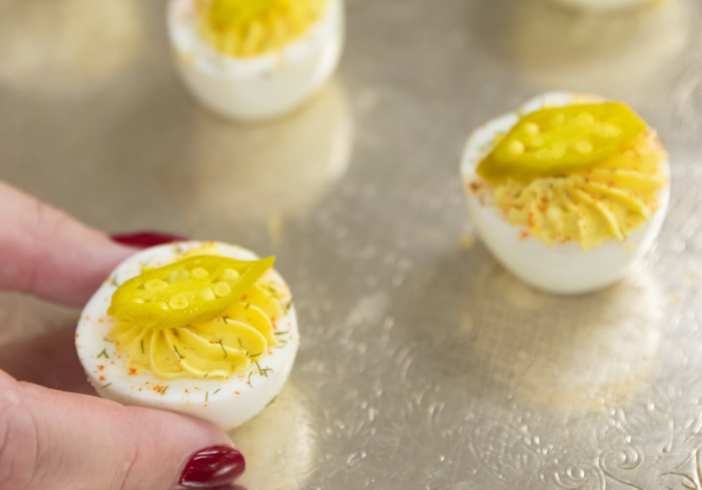 Southern deviled eggs topped with pickled okra by Hamby Catering