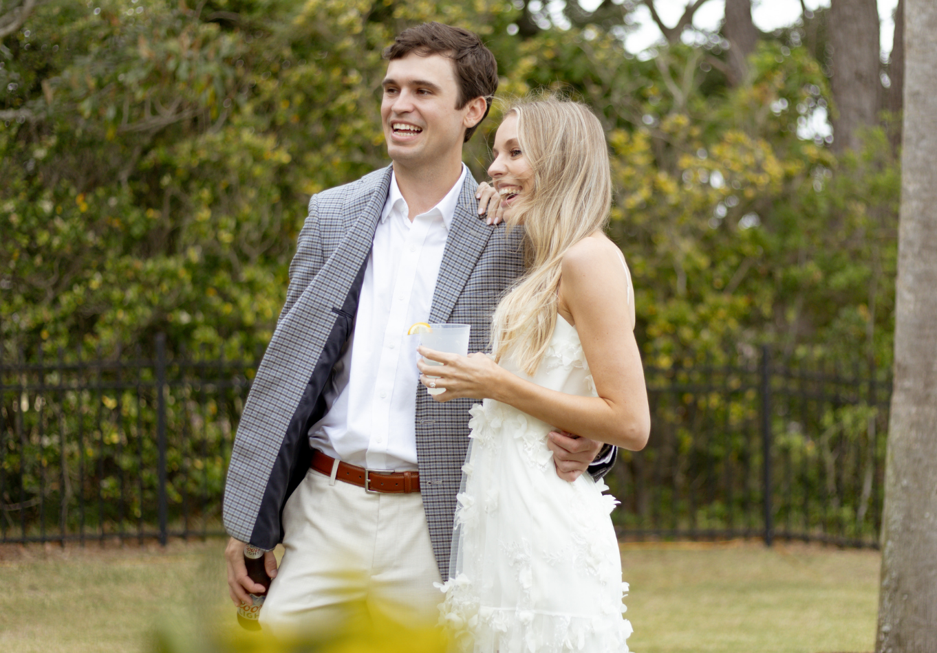 Couple celebrating outdoors during their Charleston wedding weekend catered by Hamby Catering & Events.